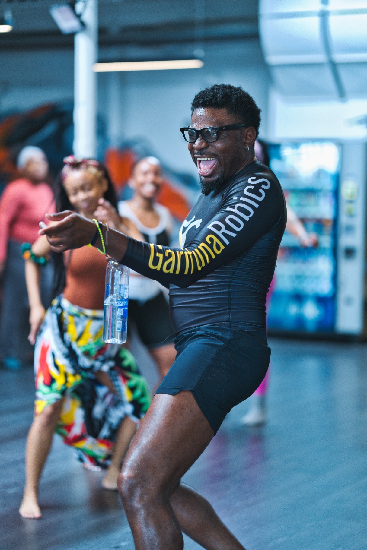 Joyful dance fitness instructor mid-class